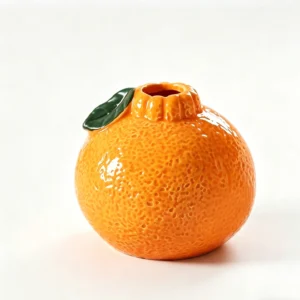 front view of orange-shaped ceramic vase