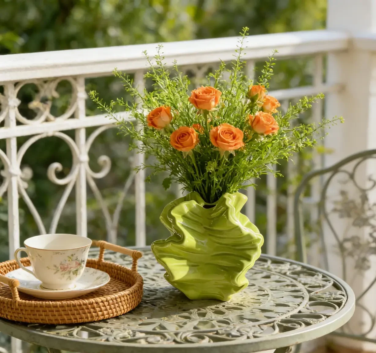 Wavy Green Ceramic Vase with roses on the table